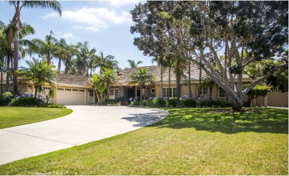 A Mission For Michael residential treatment home in Southern California surrounded by palm trees and lawns.