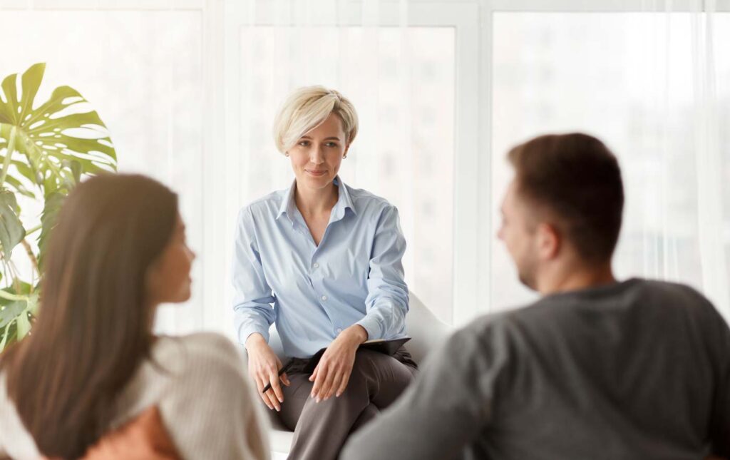 therapist with two patients in therapy