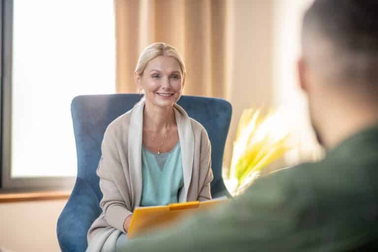 Man sitting in a therapy room during Meditation and Mindfulness Therapy