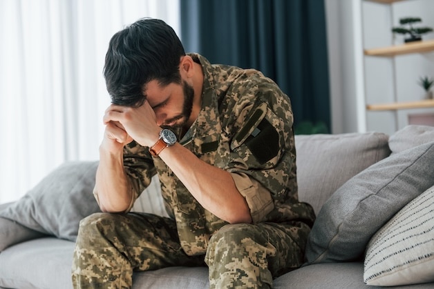 PTSD soldier in therapy visibly upset