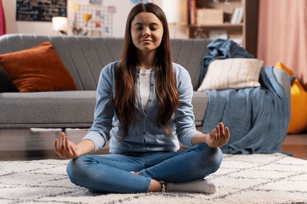 female practicing meditation for mental health recovery