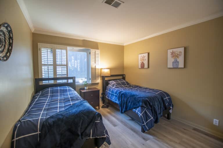 shared bedroom for residents at amfm mental health treatment on street of the blue lantern, dana point
