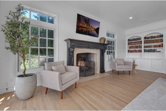 AMFM Residential, fireplace area with chairs on each side.