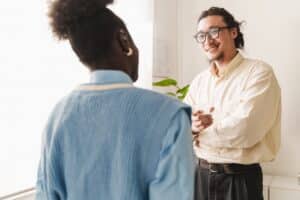 Man and a woman together talking about how to challenge anxious thoughts