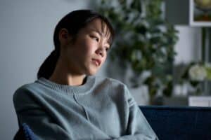 Woman staring looking worried, wondering, can anxiety kill you?