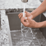 Person washing their hands vigorously in need of OCD treatment