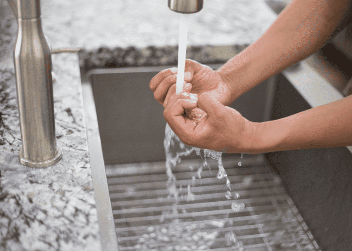 Person washing their hands vigorously in need of OCD treatment