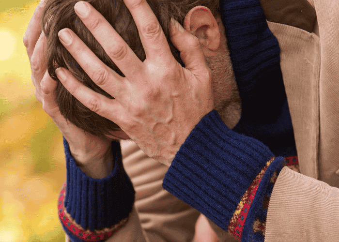 Man with his head in his hands due to high-functioning bipolar disorder