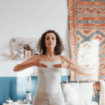 Woman practicing breathing techniques in holistic bipolar treatment centers for adults