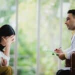 Mental health professional discussing OCD treatment with patient