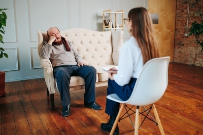 Patient discussing IOP treatment payment options with counselor