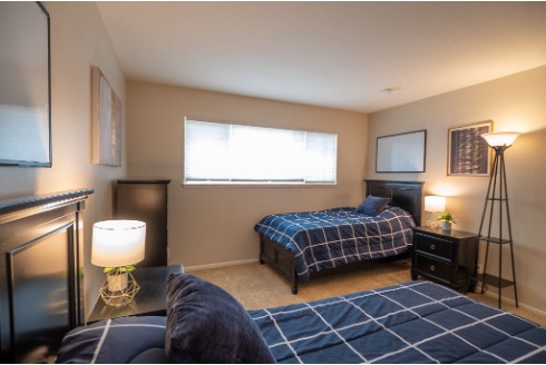 A calm, home-like bedroom at AMFM Mental Health Treatment facility where clients receive personalized OCD care in a supportive residential setting. 