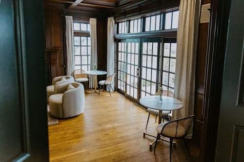 AMFM therapy room with expansive windows and comfortable seating for bipolar disorder and psychosis treatment.