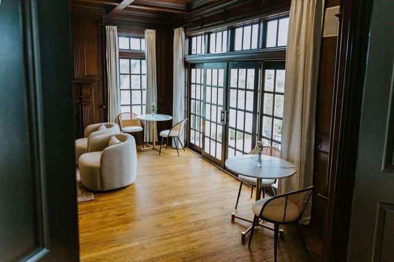 Elegant sunlit room with tables | AMFM Treatment