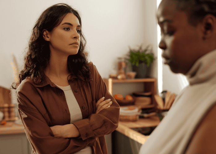 Woman with her arms crossed looking irritable due to Disruptive Mood Dysregulation Disorder