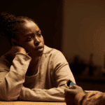 Woman looking frustrated, struggling with mood swings, asking are mood disorders genetic?