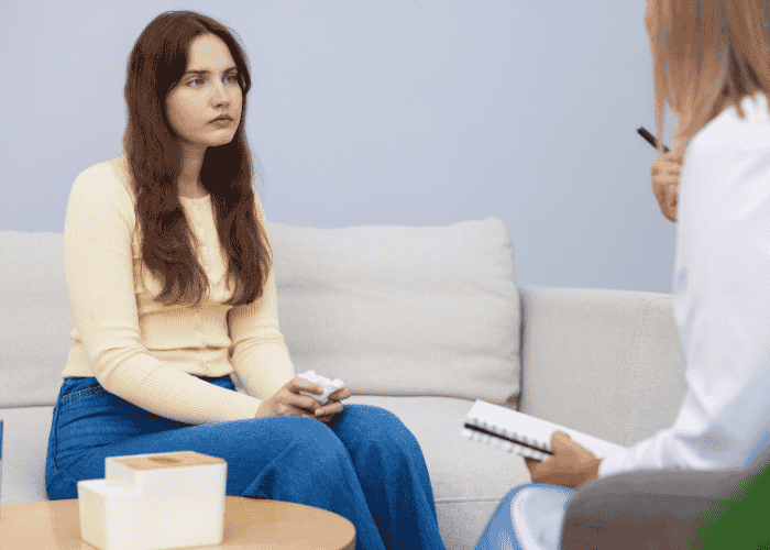 Woman in therapy after the 2025 Virginia mental health legislative session