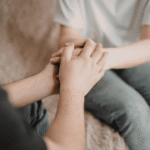 One person comforting another after learning about California's CARE act