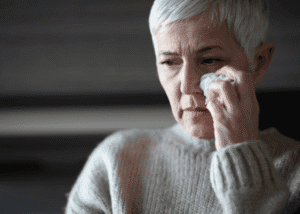 Woman crying, representing adult mental health care U.S.