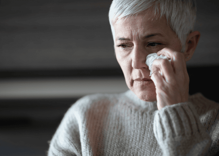 Woman crying, representing adult mental health care U.S.