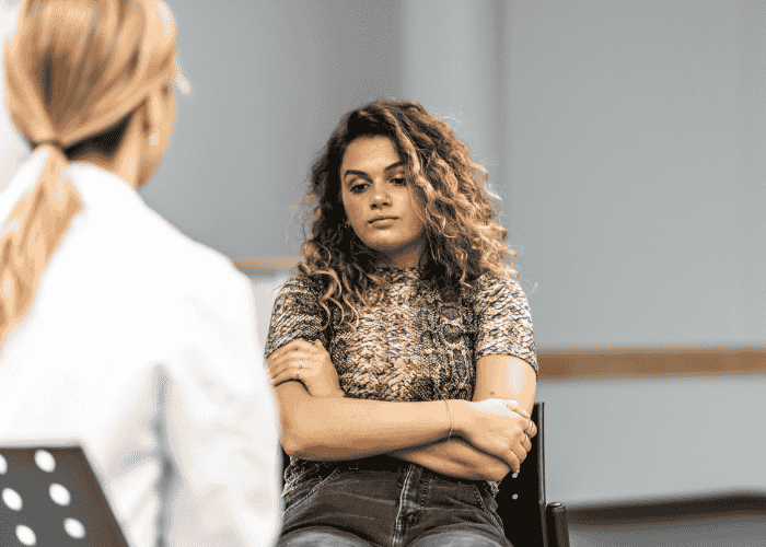 Woman in therapy discussing her mental health treatment plan