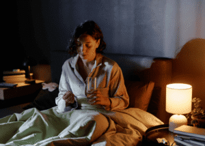 Woman taking medication as part of her mental health treatment plan