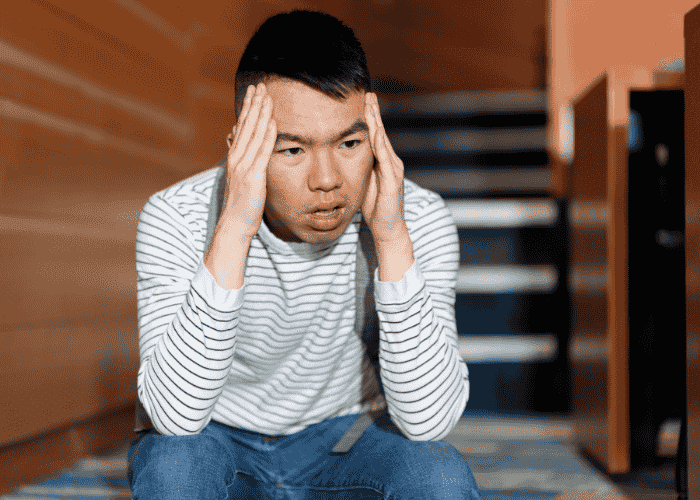 Man looking overwhelmed due to political polarization