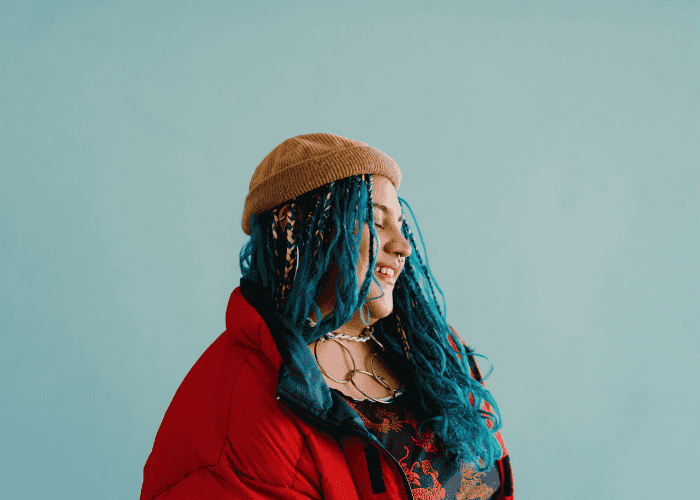 Woman smiling after learning how to manage underrecognized signs of adhd in women