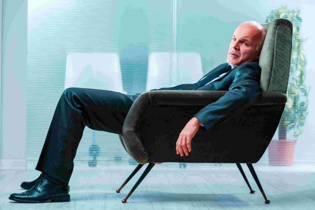 anxious man slouching in a chair