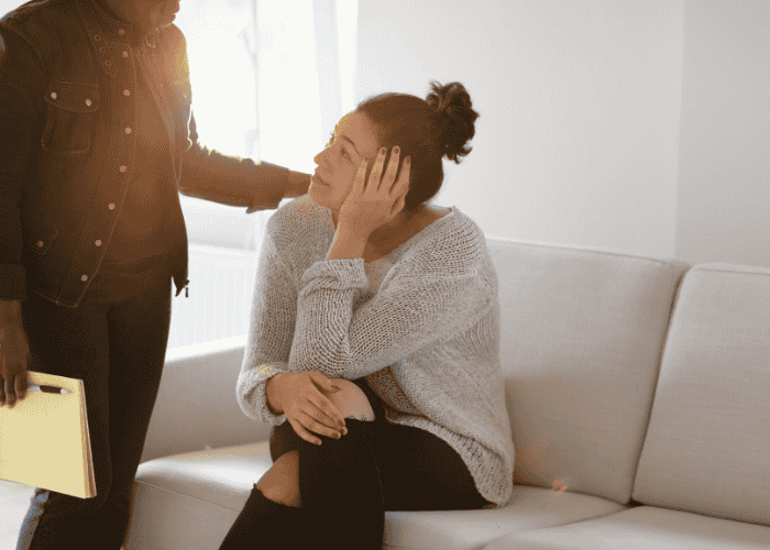woman in therapy session exploring motherhood and mental illness