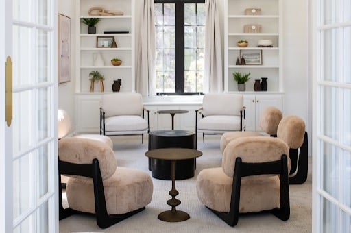 AMFM mental health treatment facility interior showing a bright, home-like common area where adults in a residential program can receive trauma-focused care in a calm, supportive environment.