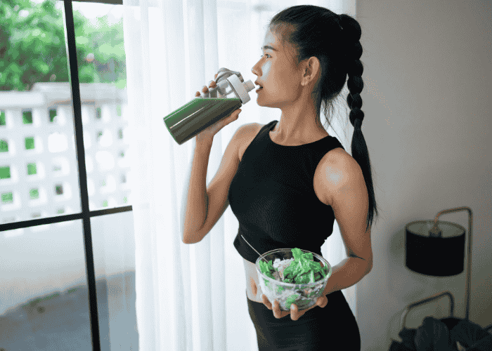 Woman looking out of the window drinking using food as medicine