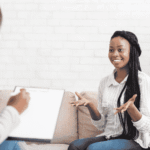 Woman sitting on a couch during accelerated resolution therapy (ART)