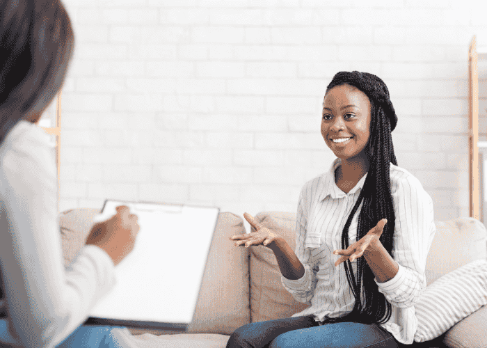 Woman sitting on a couch during accelerated resolution therapy (ART)