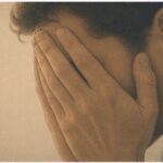 Man experiencing intense stress due to religious trauma
